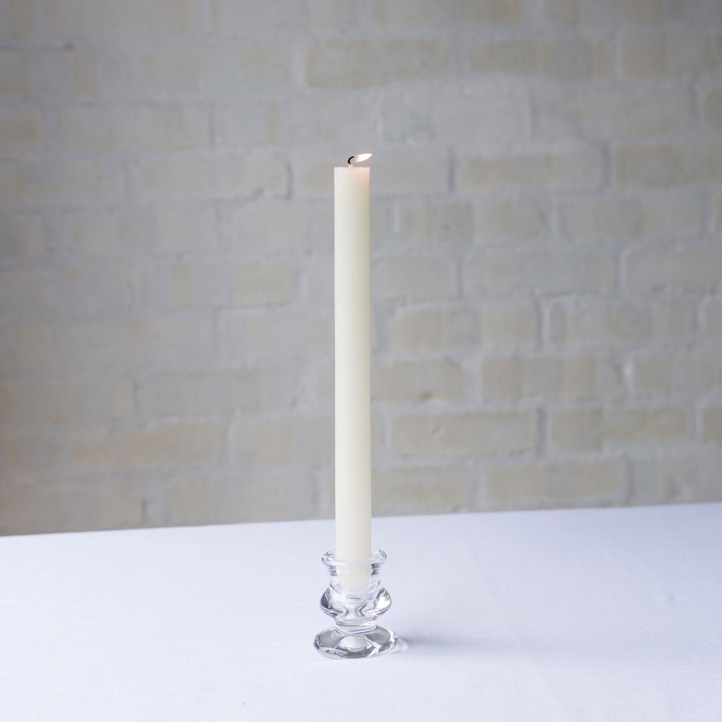 Dinner candle in clear glass holder
